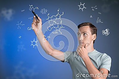 Man scientist with stylus or pen working with chemical formulas on blue background. Stock Photo