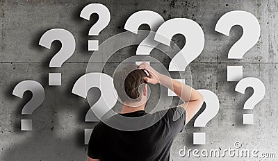 Man scratching his head in confusion Stock Photo