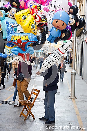 Man sealing balloons Editorial Stock Photo