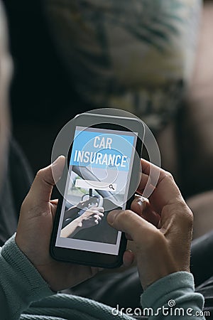 Man searches a car insurance on his smartphone Stock Photo