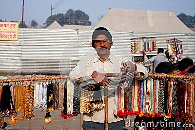 Man selling cheap jewelry and beads Editorial Stock Photo