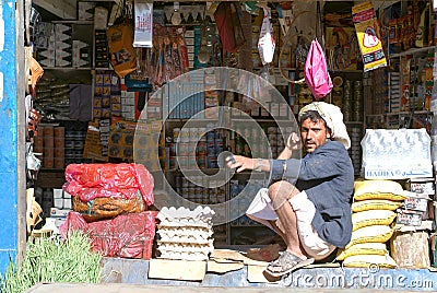 Man selling food on his small shop at Habbabah Editorial Stock Photo