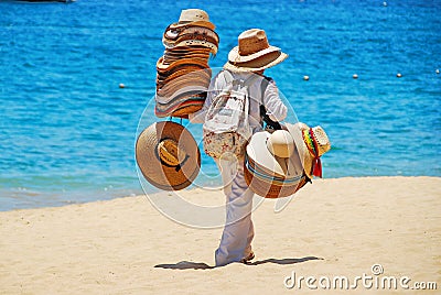 Man Selling Hats on Beach Editorial Stock Photo