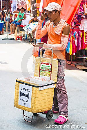 Man selling refreshments at street market Editorial Stock Photo