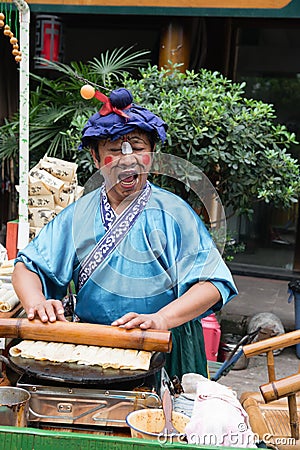 Man selling snack with show Editorial Stock Photo