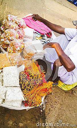 Man selling sweets and Prasad of Lord Jagannath Editorial Stock Photo