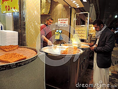 Man selling sweets on the streets of Karbala, Iraq Editorial Stock Photo