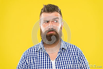 Man serious face raising eyebrow not confident. Have some doubts. Hipster bearded face not sure in something. Doubtful Stock Photo