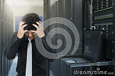 Man serious fail in data center with trouble of server Stock Photo