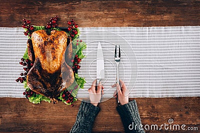 Man serving baked turkey and utensils Stock Photo