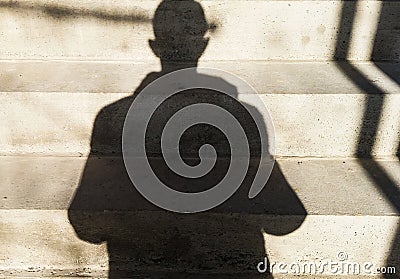 A man with a shadow Stock Photo