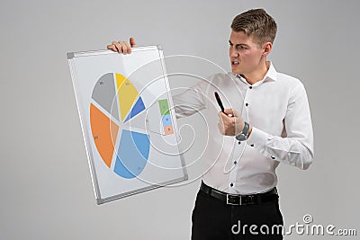 Young man holding a poster with a diagram isolated on a light background Stock Photo