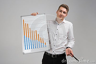 Young man holding a poster with statistics isolated on a light background Stock Photo