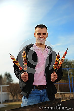 Man with a shish kebab Stock Photo