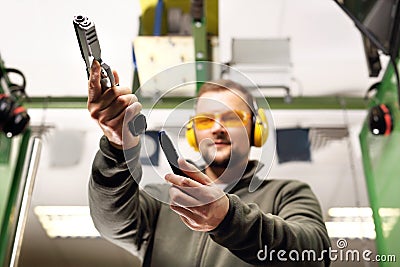 Man at the shooting range. Stock Photo