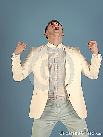 Man shouting with winner gesture Stock Photo