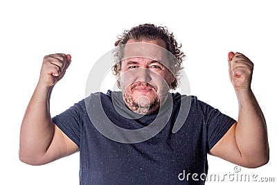 Man shouts, lifting his hands up into fists. Excited man celebrating success with hands raised against white background Stock Photo