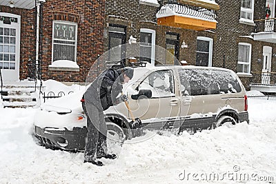 Man shovelling and removing snow Editorial Stock Photo