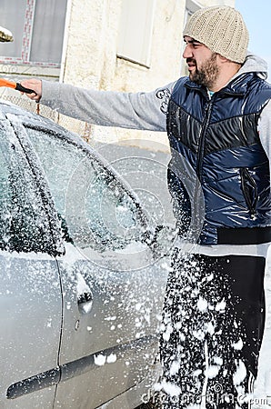 Man shovelling and removing snow Stock Photo