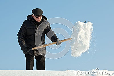 Man shovelling snow Stock Photo