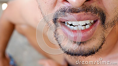 a man show up his teeth Stock Photo