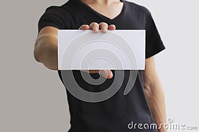 Man showing blank white flyer brochure booklet. Leaflet presentation. Pamphlet hold hands. Man show clear offset paper. Sheet temp Stock Photo