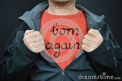 Man with words born again on his red t-shirt Stock Photo