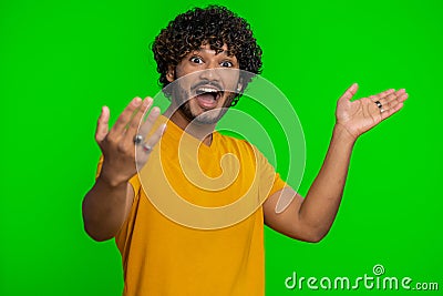 Man showing inviting gesture with hands, ask to join, beckoning to coming, gesturing hello goodbye Stock Photo