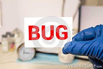 Man showing paper with BUG text Stock Photo