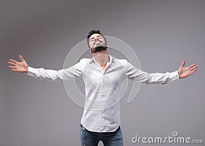 Man showing relieved gesture with spread arms Stock Photo