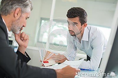 Man showing samples to coleague Stock Photo