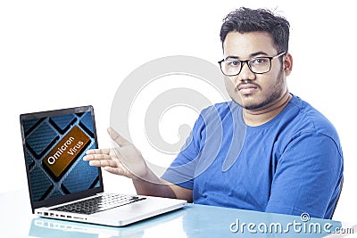 Man showing sars covid-19 variant omicron virus keyword on device screen Stock Photo