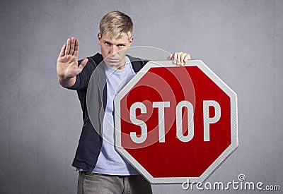 Man showing stop sign. Stock Photo