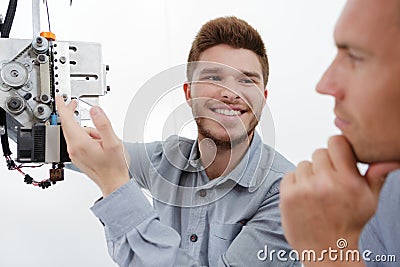 man showing teacher diy hexapod robot Stock Photo