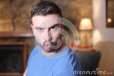 Man showing trendy cheekbones with pouted lips Stock Photo