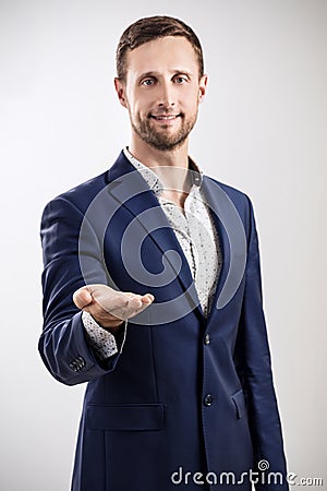 Man shows outstretched hand with open palm. Stock Photo