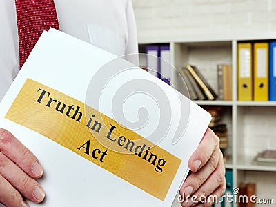 The man shows the Truth in Lending Act TILA. Stock Photo