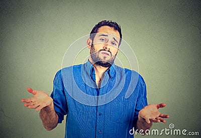 Man shrugging shoulders who cares so what I don't know gesture Stock Photo