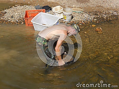 Man sieving for sapphires Editorial Stock Photo