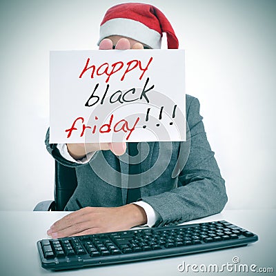 Man with a signboard with the text happy black friday Stock Photo