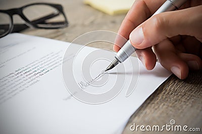 Man signing contract Stock Photo