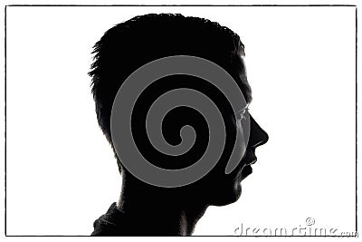 Man silhouette in profile on white background and messy hairstyle. portrait silhouette young man in studio isolated on white backg Stock Photo