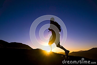 Man Silhouette Running Sunset Mountain Range Concept Stock Photo