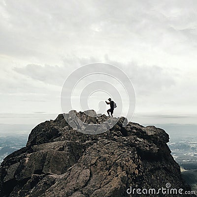 Man silhouette on the top of the mountain Editorial Stock Photo