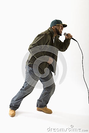 Man Singing Into Microphone Stock Photography - Image: 5137842