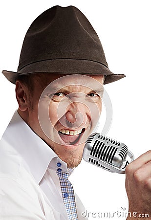 Man sings expressively into microphone Stock Photo