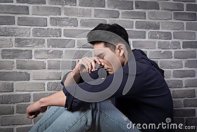 Man sit and feel depressed Stock Photo