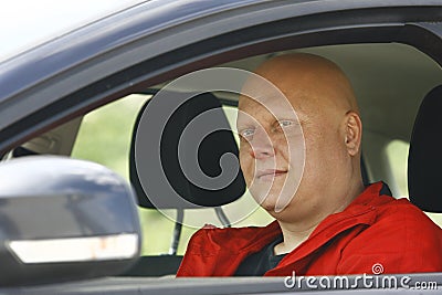 Man Sits In Driver's Seat And Looking Out Window Stock Photo