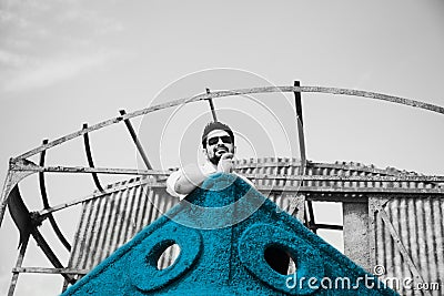 Man sitting on an abandoned ships unique photo Stock Photo