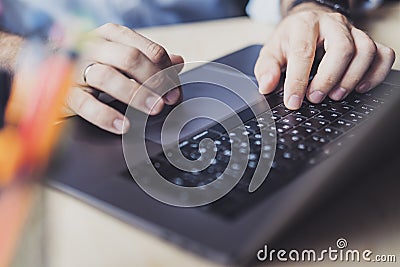 Man sitting at desk,working on laptop.Close-up male hands typing on keyboard. Businessman working on Internet.Online homebased job Stock Photo